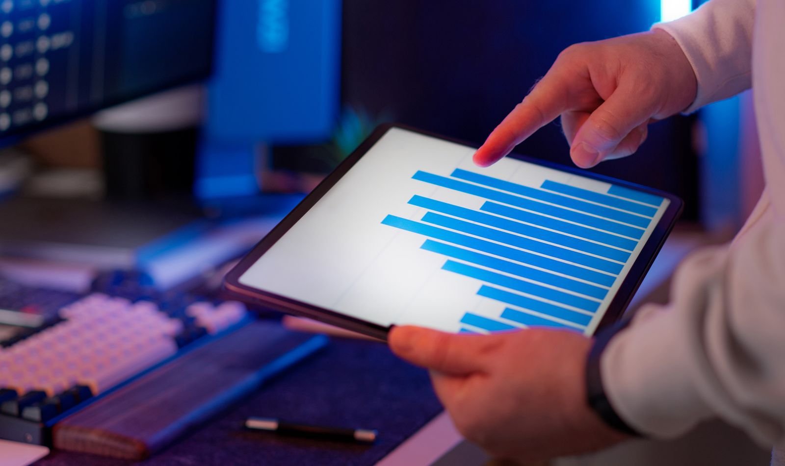 Agency manager reviewing client performance charts on a tablet