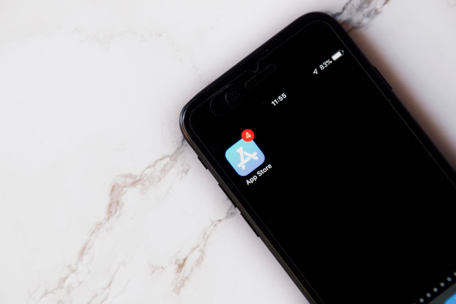 App Store icon with a notification badge on an iPhone home screen