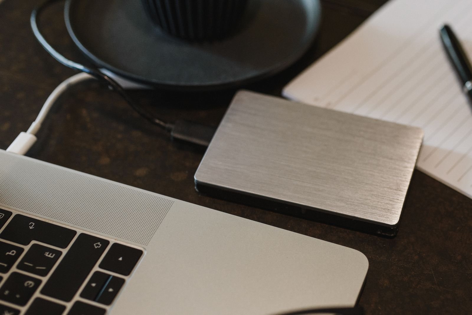 External SSD drive connected to a laptop for video cache and media storage