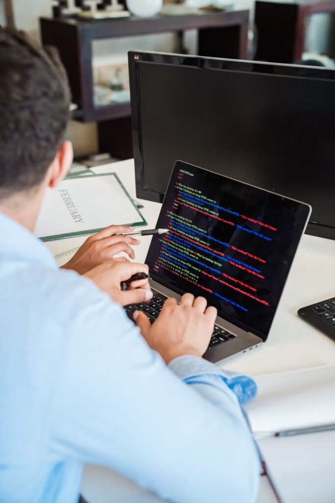 Developer typing Swift code in Xcode while localizing an iOS app