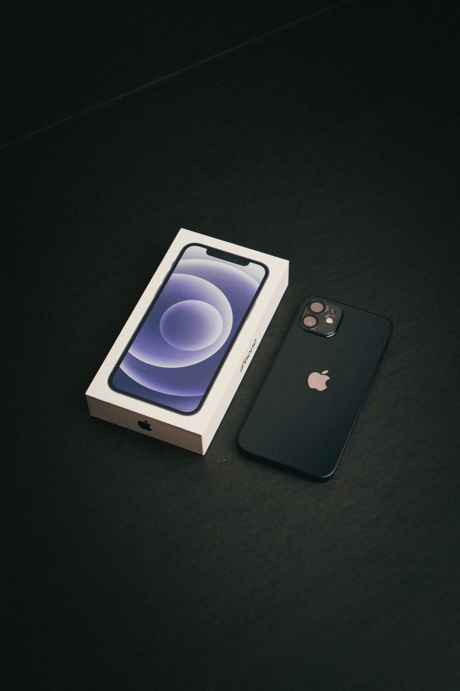 New iPhone with its retail box, ready for its first iOS update