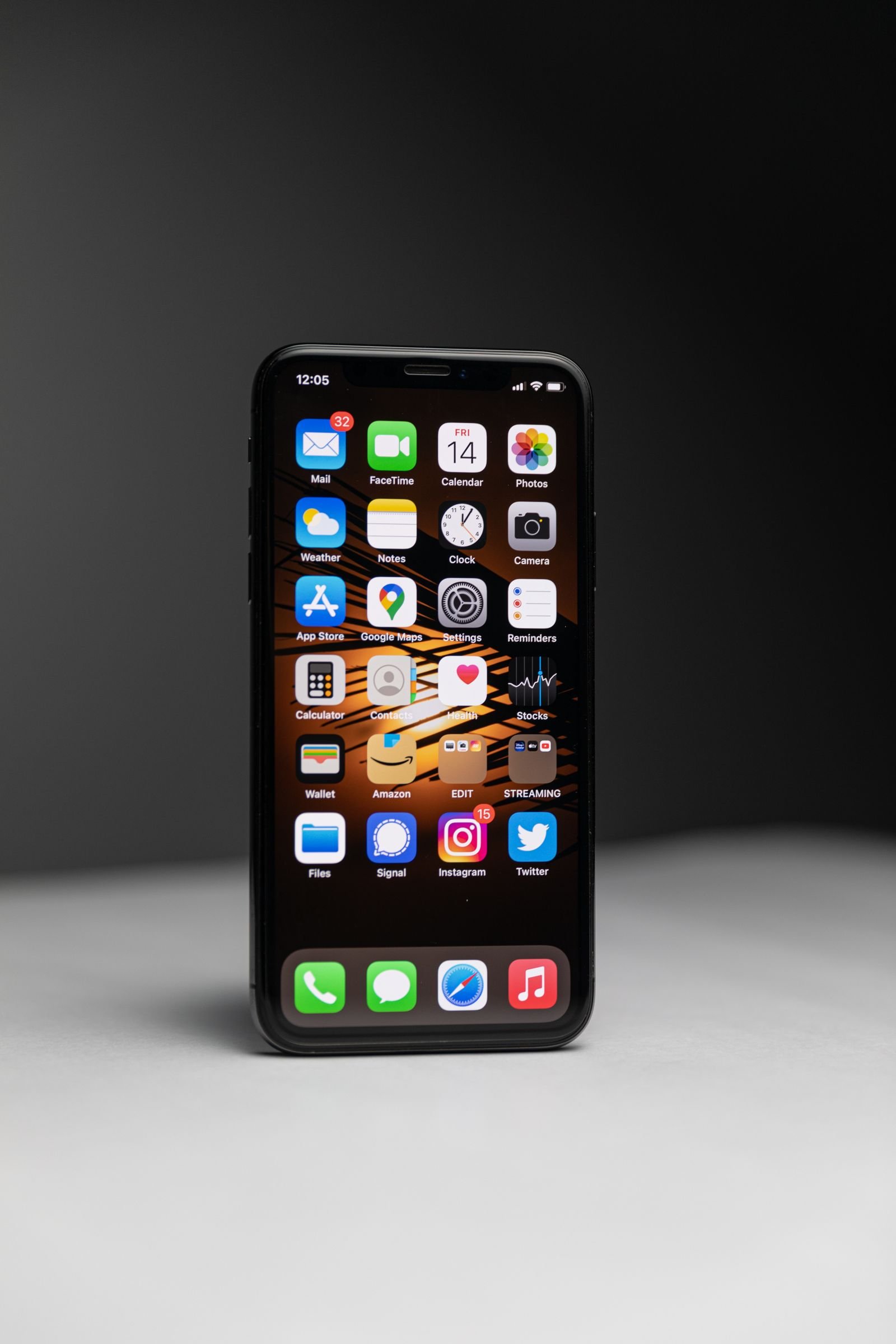 iPhone app icons on a dark screen while searching for the missing screen recording control