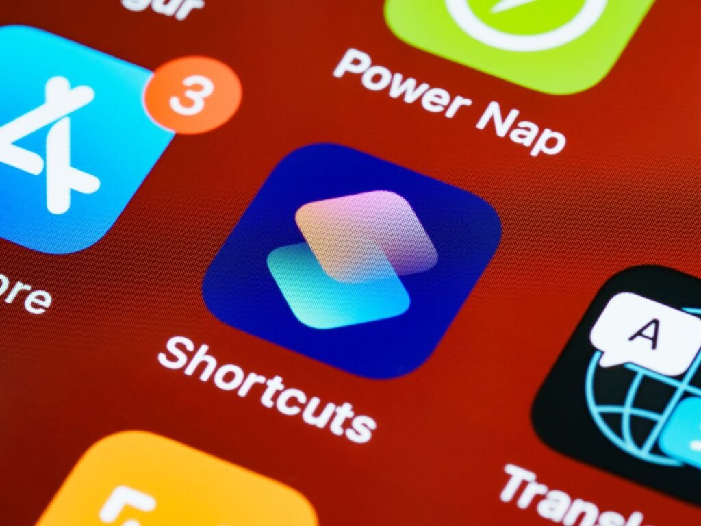 Close-up of iPhone home screen app icons showing Apple design system consistency