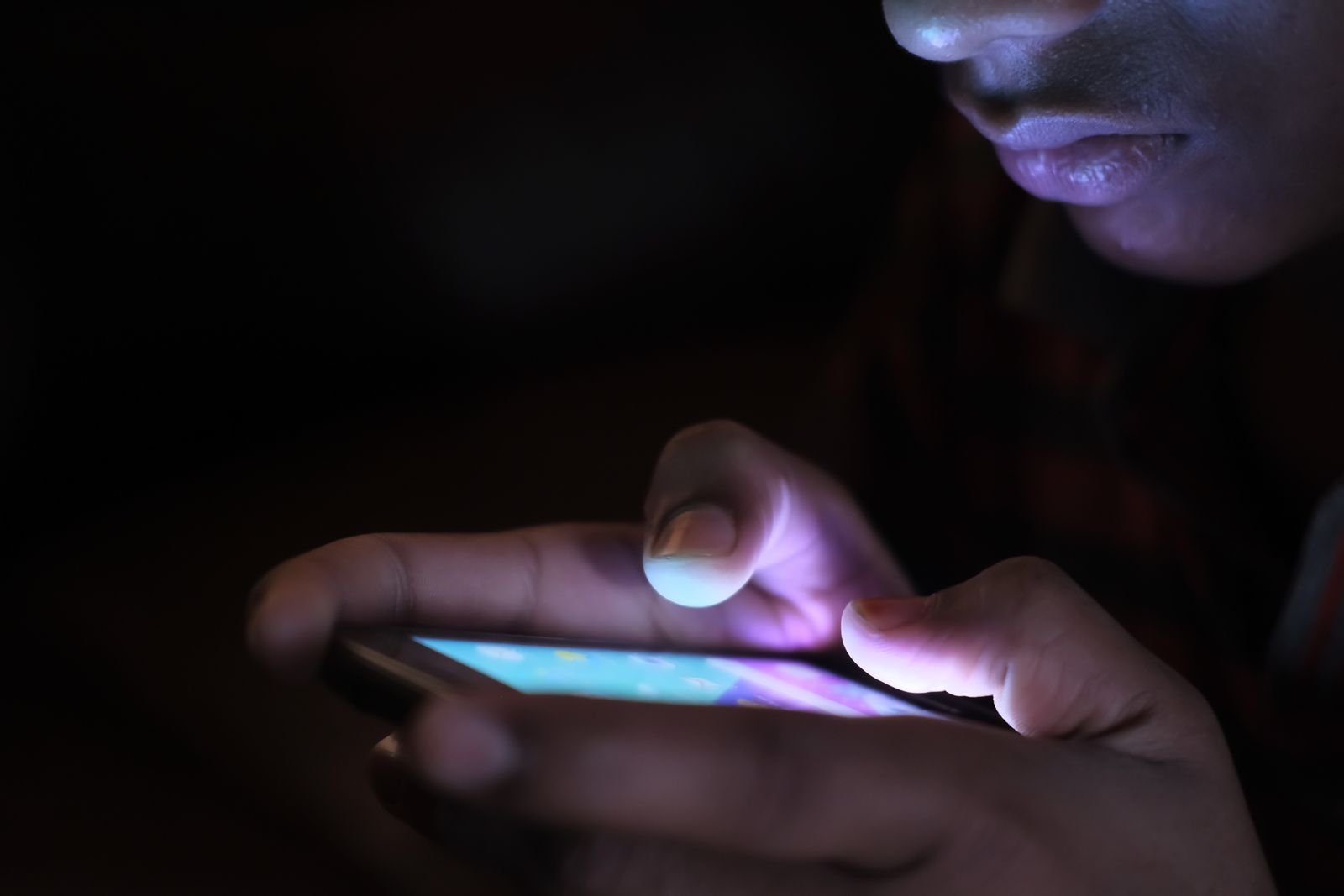 Illuminated iPhone screen in the dark during a screen recording with microphone audio