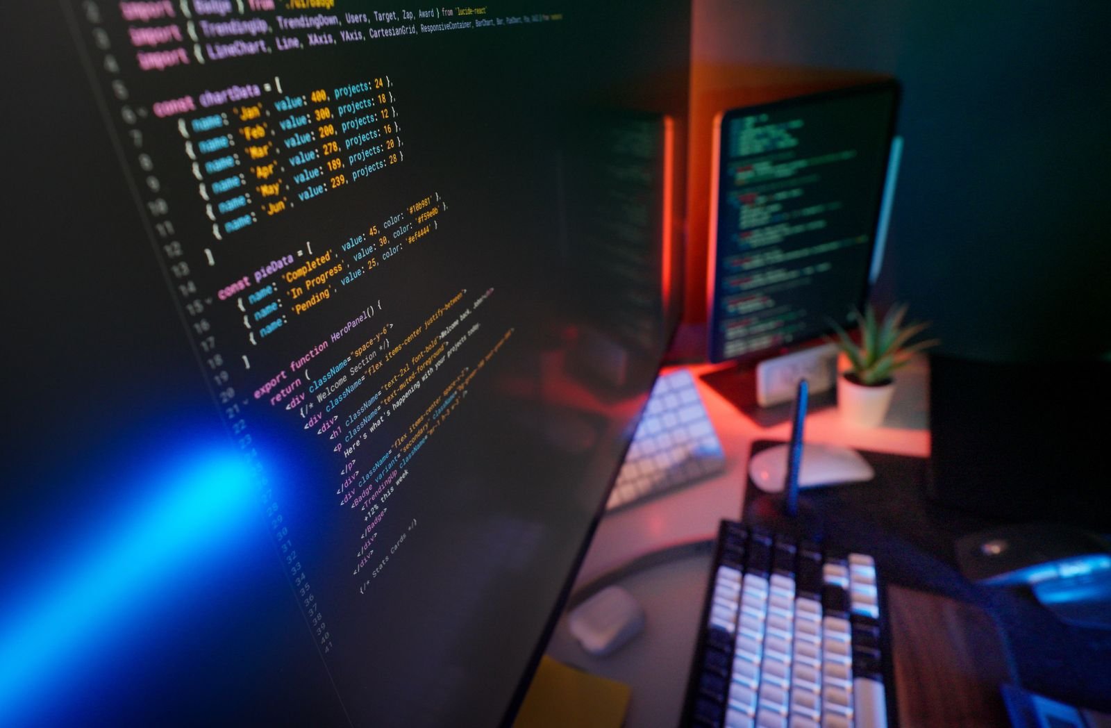 Colorful code on multiple monitors representing multi-architecture Docker builds