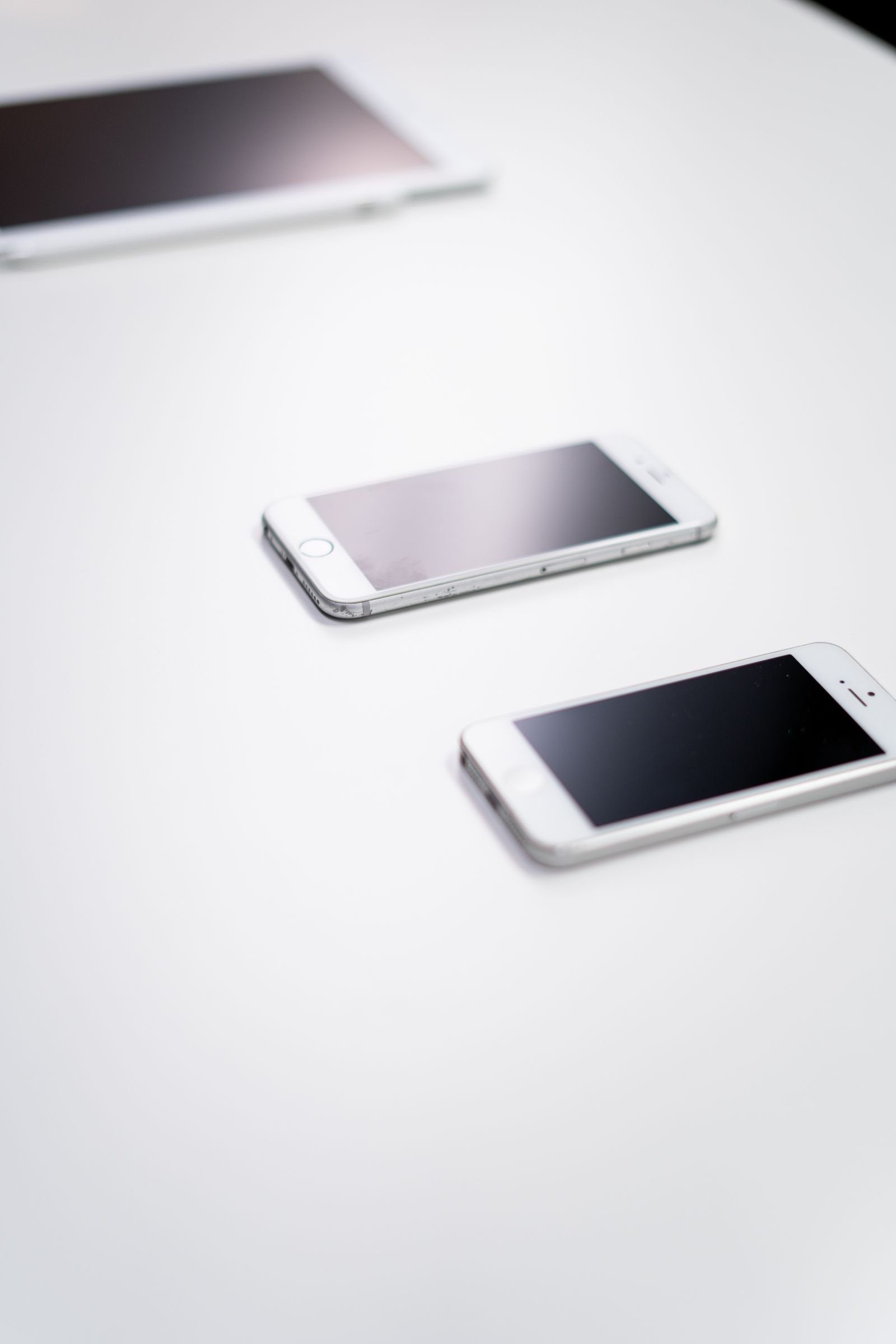 iPhone running iOS 26 held in hand, ready to start a screen recording